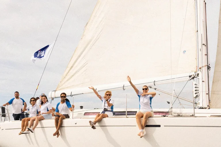 Team building on a sailboat with Ineventing DMC Gran Canaria - group sailing and celebrating at sea